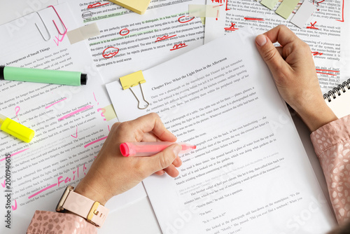 Tableau sur toile Top view of detailed text correction with visible mistakes and edits, proofreading and quality control of written content using markers and notes