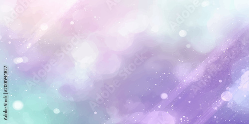 Bright abstract blue bokeh background with colorful blurred circle patterns and glowing holiday glitter sparkles for a festive winter design
