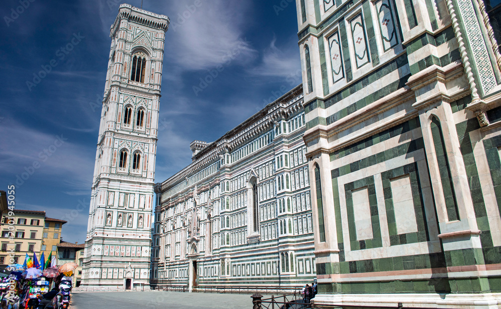Fototapeta premium Piazza del Duomo in Florence, with a particular focus on Giotto's majestic Bell Tower next to the Cathedral of Santa Maria del Fiore.