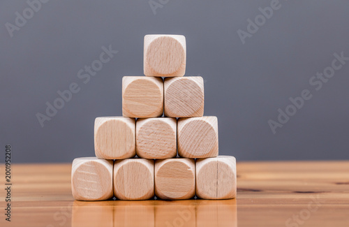 Fotografie Wooden blocks arranged in a pyramid