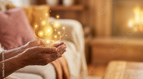 Elderly person holding glowing orbs in a cozy living room  