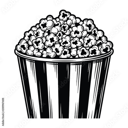 Freshly popped popcorn in a striped bucket for snacking at the movies