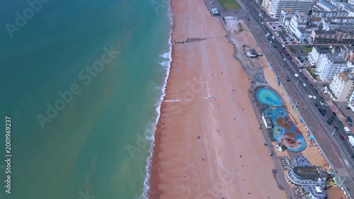 Aerial glide along Brighton promenade with historic hotels and ocean view