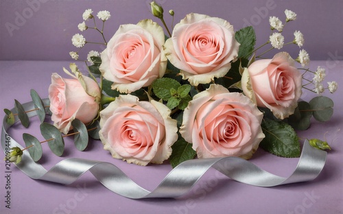 Pink roses white baby's breath eucalyptus and silver ribbon on purple