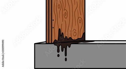 Wooden post with dark material dripping onto concrete foundation