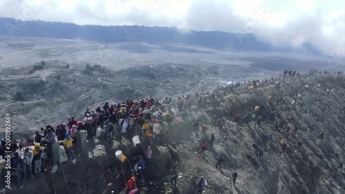 Crowds of tourists and locals at the edge of Mount Bromo crater, East Java, Indonesia.