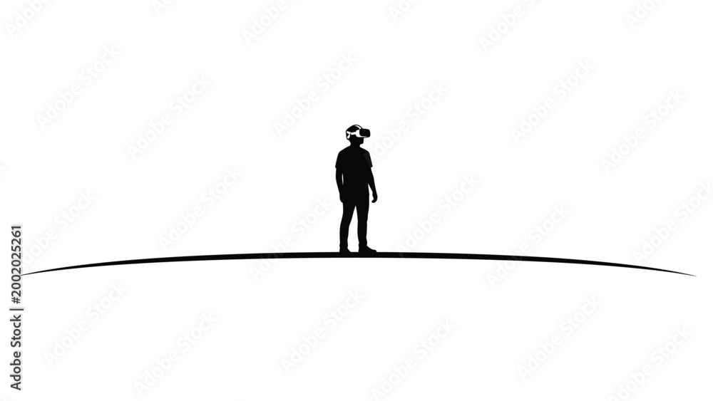 Fototapeta premium silhouette of a man standing using VR
