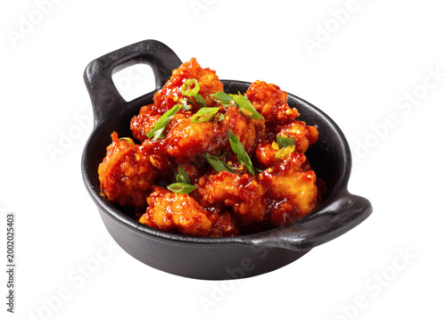 Delicious Spicy Glazed Korean Fried Chicken Bites with Scallions in a Black Bowl