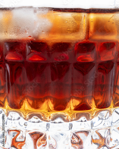 Premium Whiskey with Ice in Crystal Glass Vertical Studio Shot