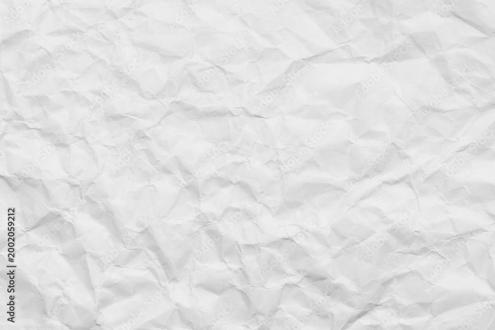 Naklejka premium White crumpled paper texture background,Macro,High angle view of white crumpled paper texture background, full frame. Detailed surface of creased and wrinkled paper for background and design elements.