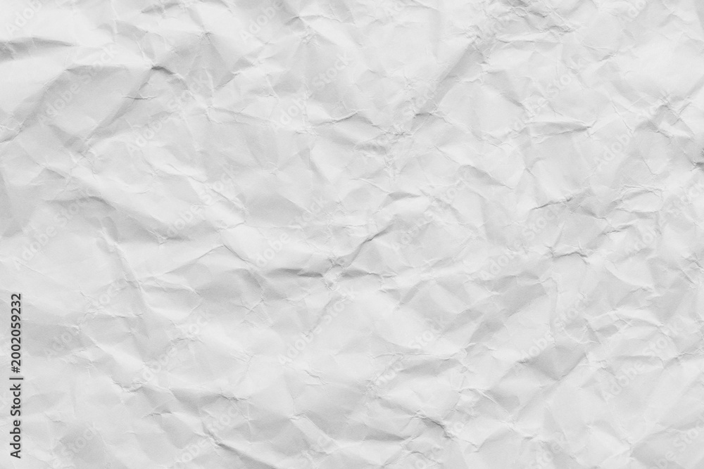 Naklejka premium White crumpled paper texture background,Macro,High angle view of white crumpled paper texture background, full frame. Detailed surface of creased and wrinkled paper for background and design elements.