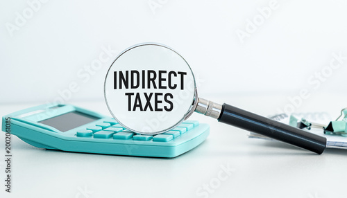Photos Magnifying glass highlights INDIRECT TAXES text