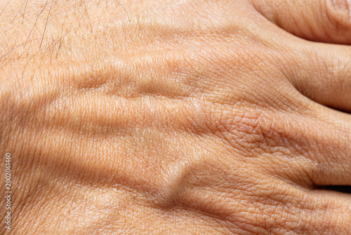 Canvastavla Macro Detail of Human Skin Texture and Veins on Back of Hand,Extreme close-up shot showing the intricate details of human skin texture, pores, and visible veins on the back of an adult's hand