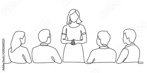 Woman giving a presentation to a group of people in a meeting
