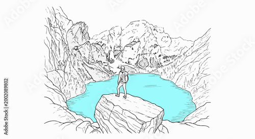 Hiker on rock overlooking turquoise lake amidst mountains