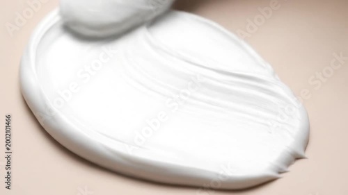 Close up white cream texture on beige background
