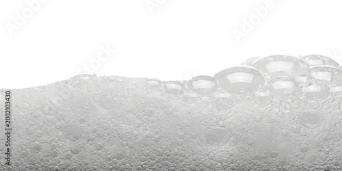 Close up of soap bubbles floating in water texture creating a soft foam layer with round circle shapes