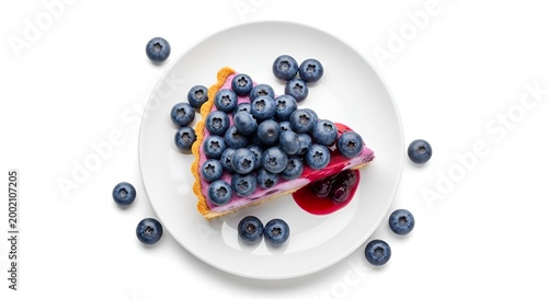 slice of blueberry cheesecake on a white plate with fresh blueberries