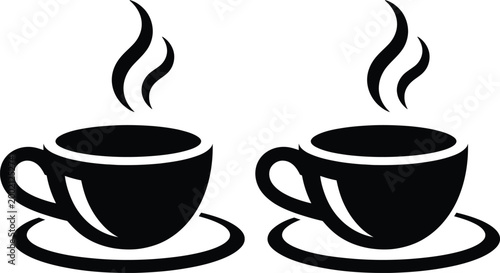 Two steaming cups of coffee on matching saucers side by side