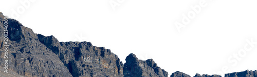 Obraz na plátne Bleak rocky gray mountain range with rugged terrain and minimal vegetation, dramatic landscape with a transparent sky backdrop