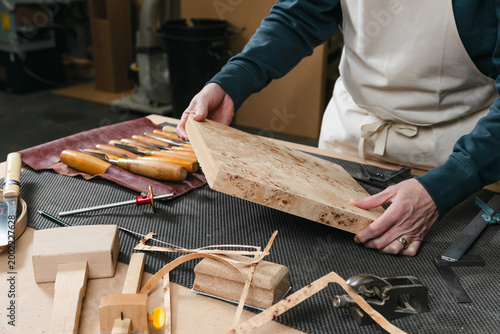 Artisan furniture maker in workshop environment