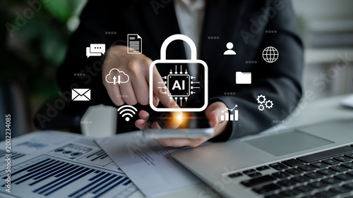 Business professional interacts with smartphone while visualizing AI security and data management concepts, demonstrating modern technology integration in the workspace. Gantry
