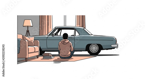 Man sits on floor looking at vintage car in room.