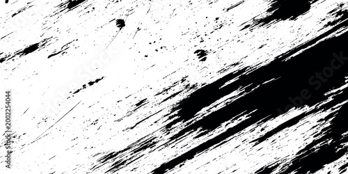 Black and white grunge texture with diagonal streaks and scratches on a distressed background for creative design projects