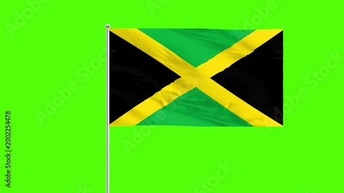Jamaican Flag on Green: Capturing the vibrant spirit of Jamaica, a flag waves proudly against a dynamic backdrop. Embodying national pride and cultural heritage.
