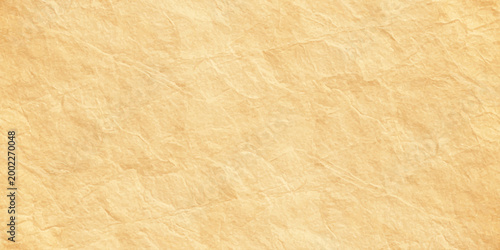 Abstract light orange textured paper background with organic parchment crinkle and soft vintage stone wash effect