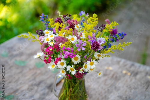 Beautiful bouquet with summer wild flowers and margaritas 