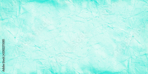 Light teal marble texture background with soft white veins and ethereal crumpled paper effect for elegant web design