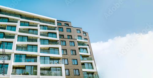Modern  Residential Apartment Building Complex Condo on a Blue sky background