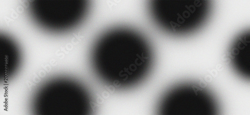 Abstract Minimalist Black Polka Dot Pattern with Grainy Noise Texture and Soft Blur Gradient Background for Modern Graphic Design