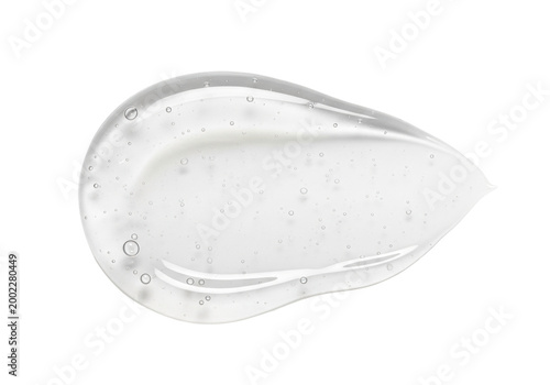 Macro shot of translucent white cosmetic gel smear, viscous texture with tiny particles and bubbles, isolated on a transparent background. concept of high-end skincare luxury