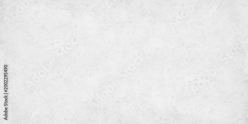 White concrete wall texture background with subtle grain and light grey distressed stone effect. white cement or plaster wall texture. light grey weathering and a fine granular surface