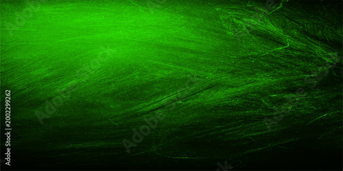 Green chalkboard with dark shade, textured surface that's perfect for educational or artistic concepts.
