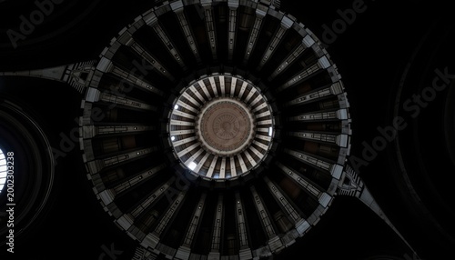 Symmetrical Interior of a Dark Circular Dome with Concentric Architectural Patterns