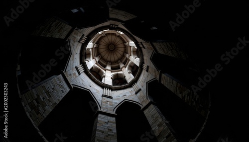 Intricate Gothic Stone Arch Ceiling with Dramatic Circular Light