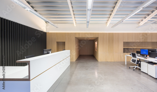 Modern candy factory reception area with office workspace