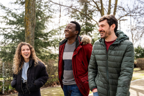 Group of friends having fun outdoors in winter