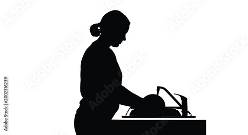 Woman in silhouette ironing clothes on an ironing board at home