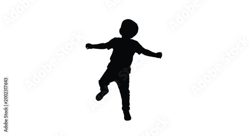 Silhouette of a child jumping in the air with arms outstretched and one leg bent