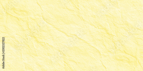 Pale yellow crumpled paper texture background with soft shadows and organic crinkled parchment surface for minimal design