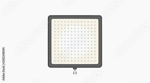 A bright, square panel light with numerous illuminated bulbs emits a strong, directional glow, ready for use. 