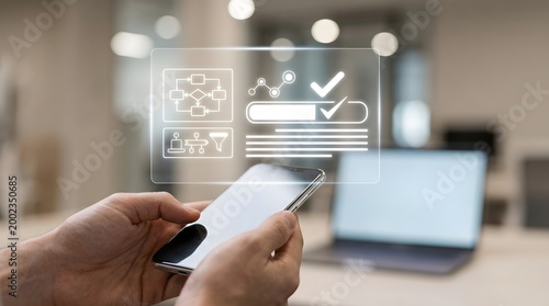 Man holding smartphone with holographic interface showing process diagram, data chart, and checklist with checkmarks for business automation and analytics.
