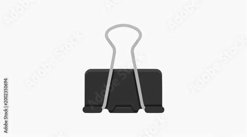 A simple studio shot of a binder clip, commonly found in office and study environments. This image can be used to visualize projects, document management, and organizational aspects.