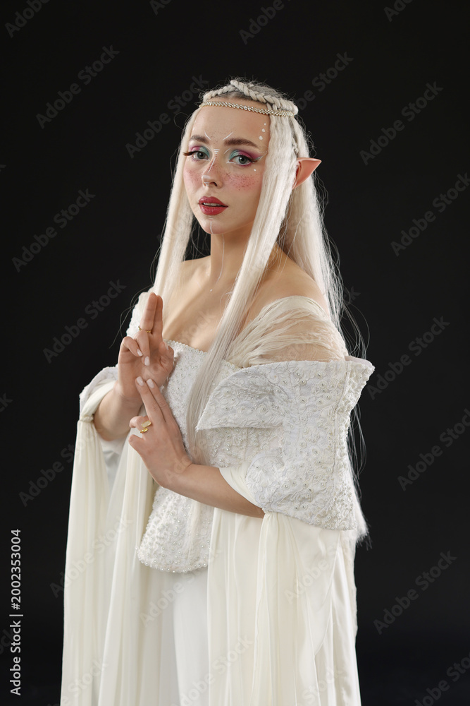Fototapeta premium Portrait of beautiful elf girl on black background