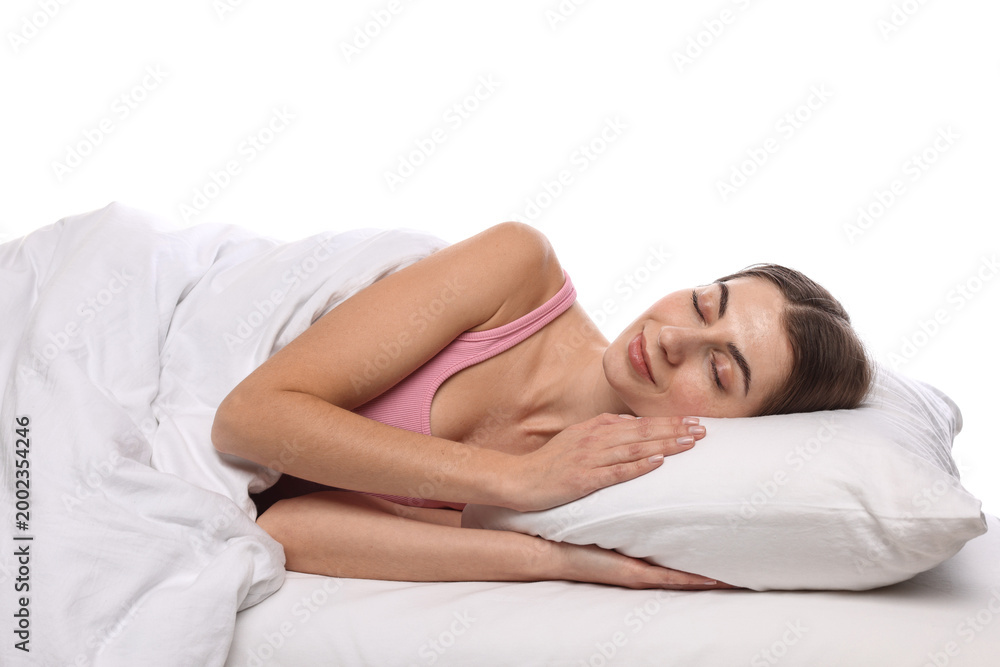 Obraz premium Woman covering with blanket sleeping in bed against white background
