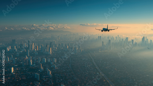 Airplane soaring over expansive urban skyline at dawn light horizon, nice background
